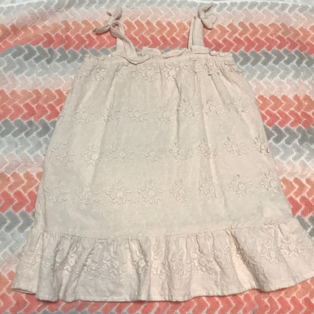 Cream colored dress with no sleeves